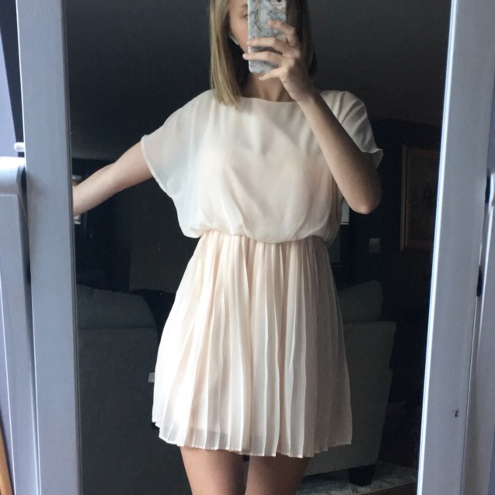 cream colored dress.
